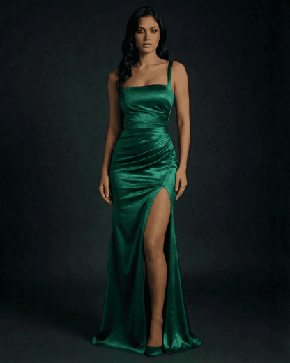 Celestine Maxi Dress by SLIMONA in luxurious emerald green satin with a high slit design.