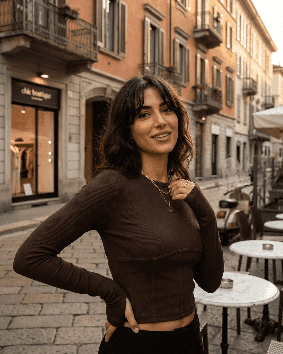 Model wearing Cocoa Corset Top from SLIMONA in an urban setting, showcasing casual elegance and structured design.