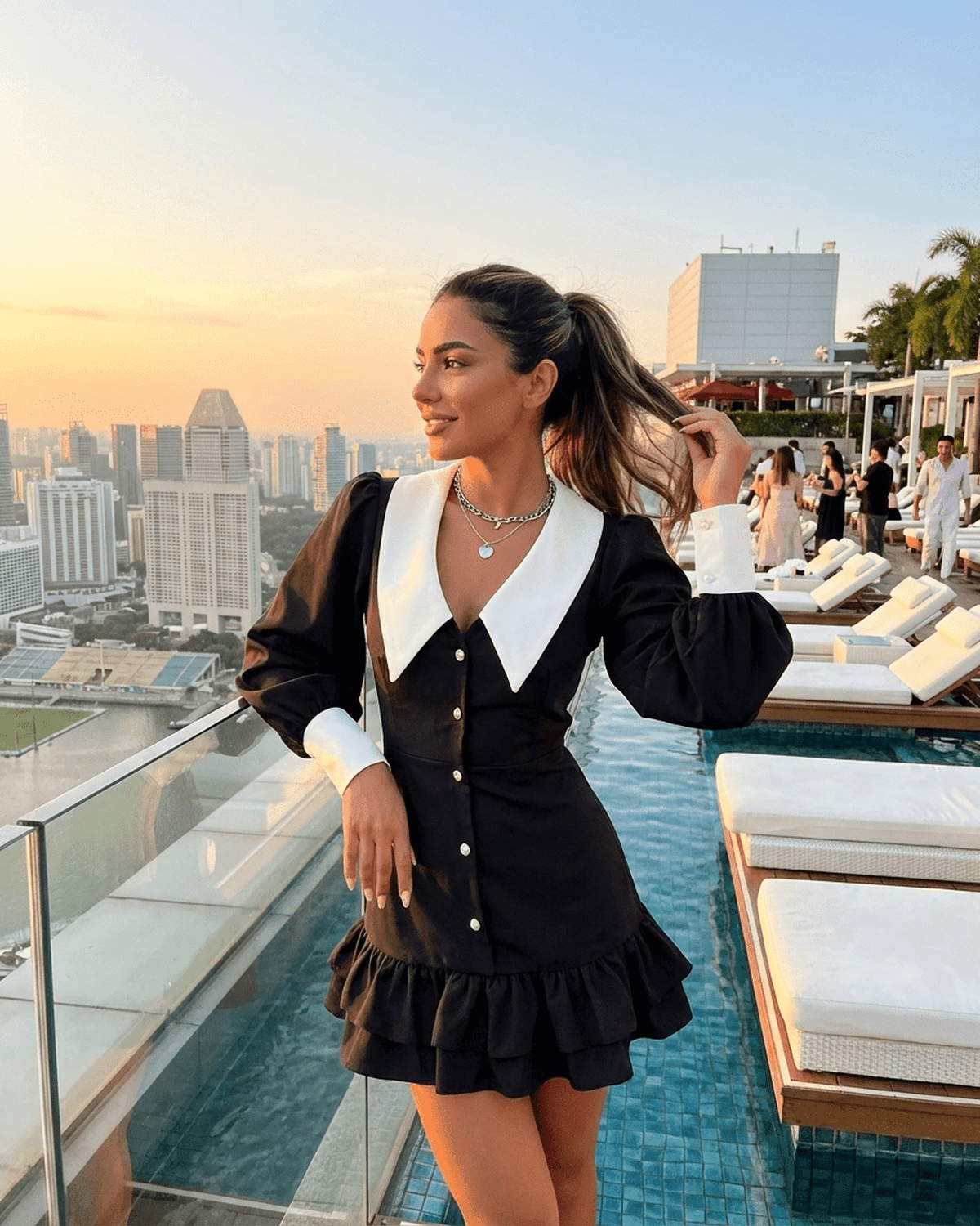 Corinne Mini Dress by SLIMONA, elegant black and white color block design with puffed sleeves, perfect for stylish occasions.