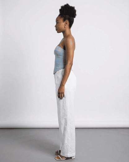 Model wearing Denali Corset Top by SLIMONA, showcasing faux denim fabric in a sleek, structured design.