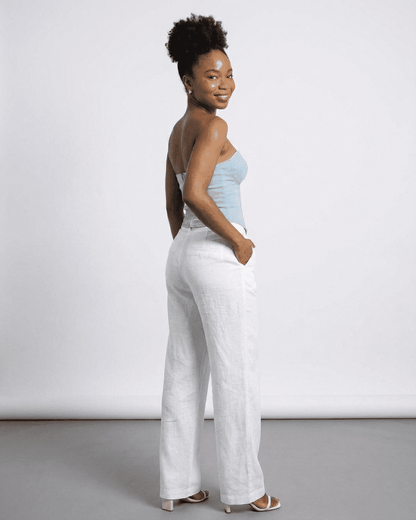 Denali Corset Top by SLIMONA showcased on a model wearing white pants, highlighting its stylish slim design.
