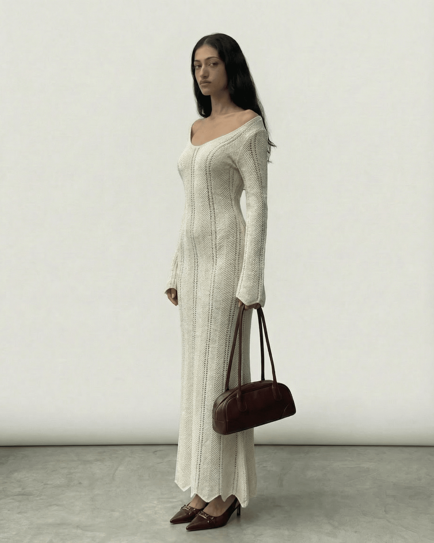 Elara Maxi Dress by Lauven featuring ribbed V-neck bodycon silhouette and long flare sleeves.