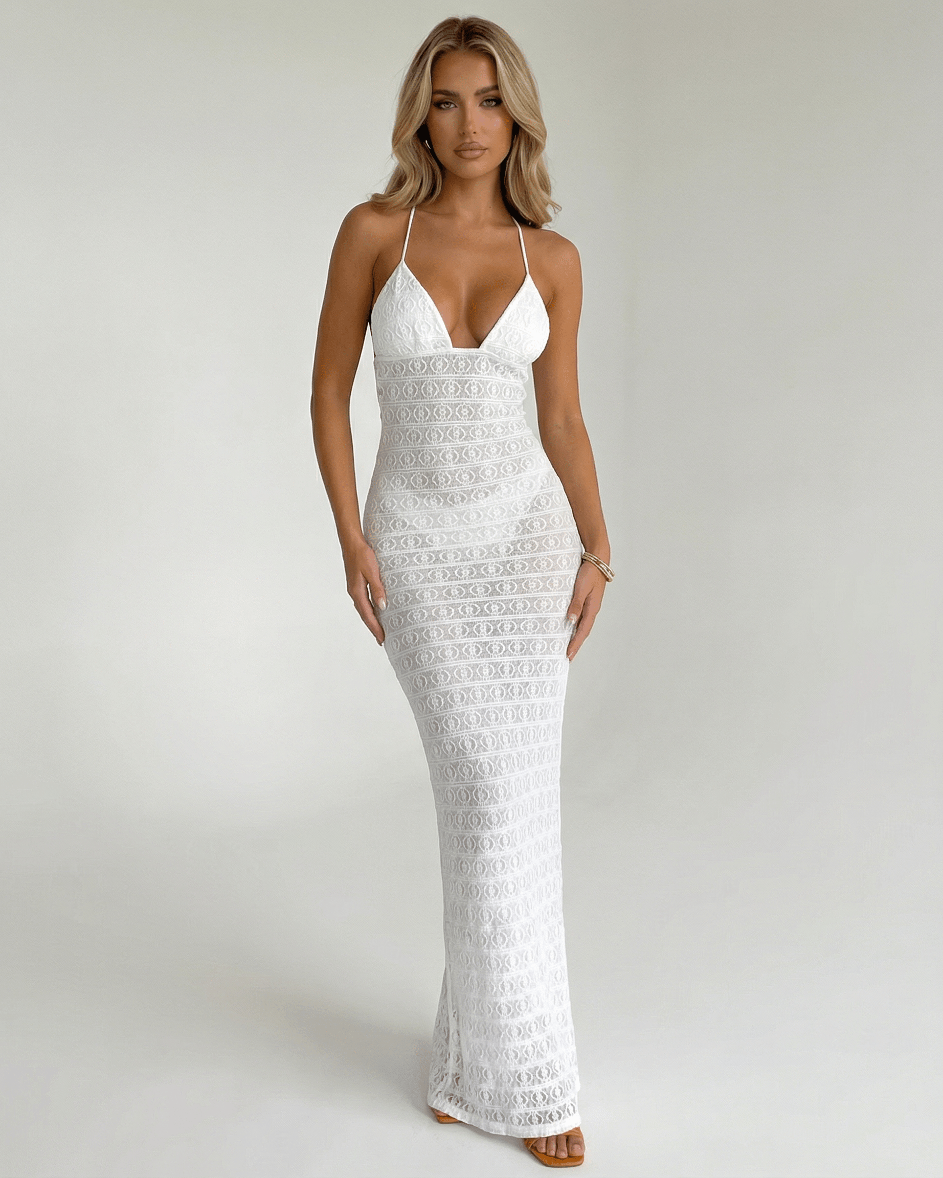 Elara Maxi Dress by Lauven: Elegant white lace V-neck halter dress featuring a sleek silhouette and delicate design.