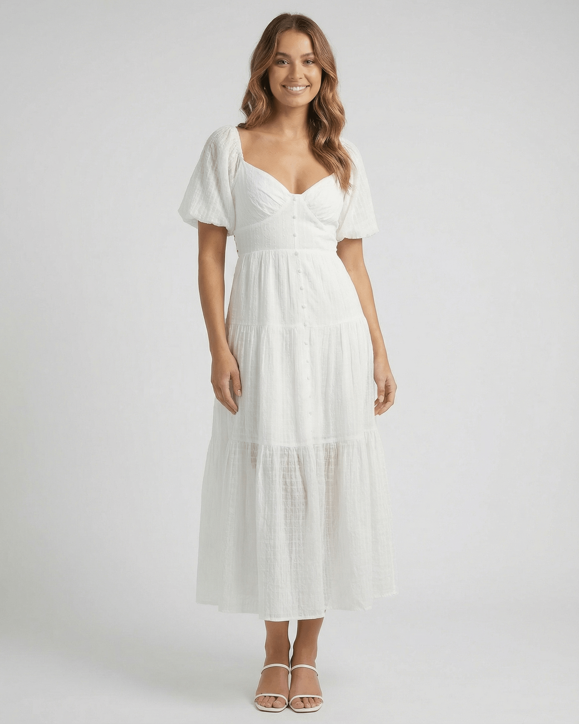 Elara Midi Dress by Lauven – Elegant white A-line silhouette with puff sleeves, perfect for modern femininity.