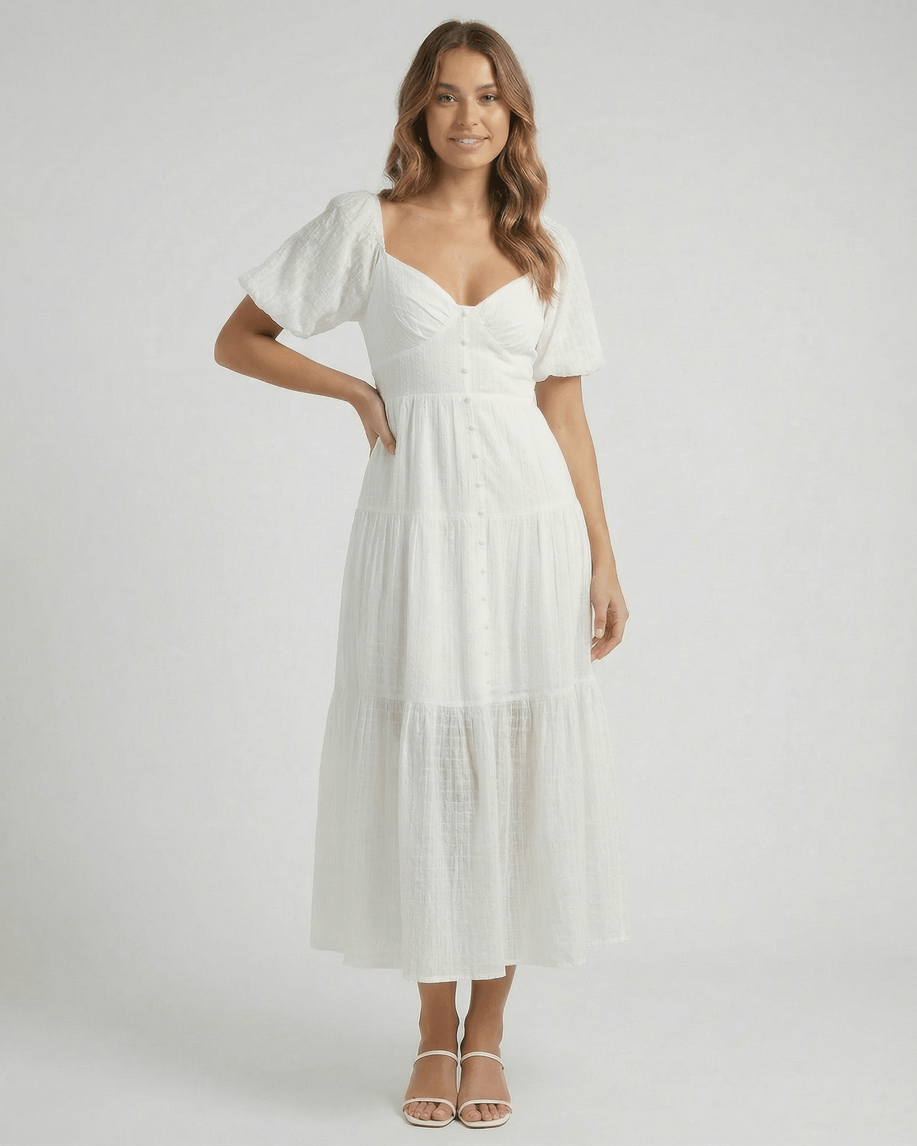 Elara Midi Dress by Lauven, elegant white A-line silhouette with puff sleeves, perfect for modern femininity.