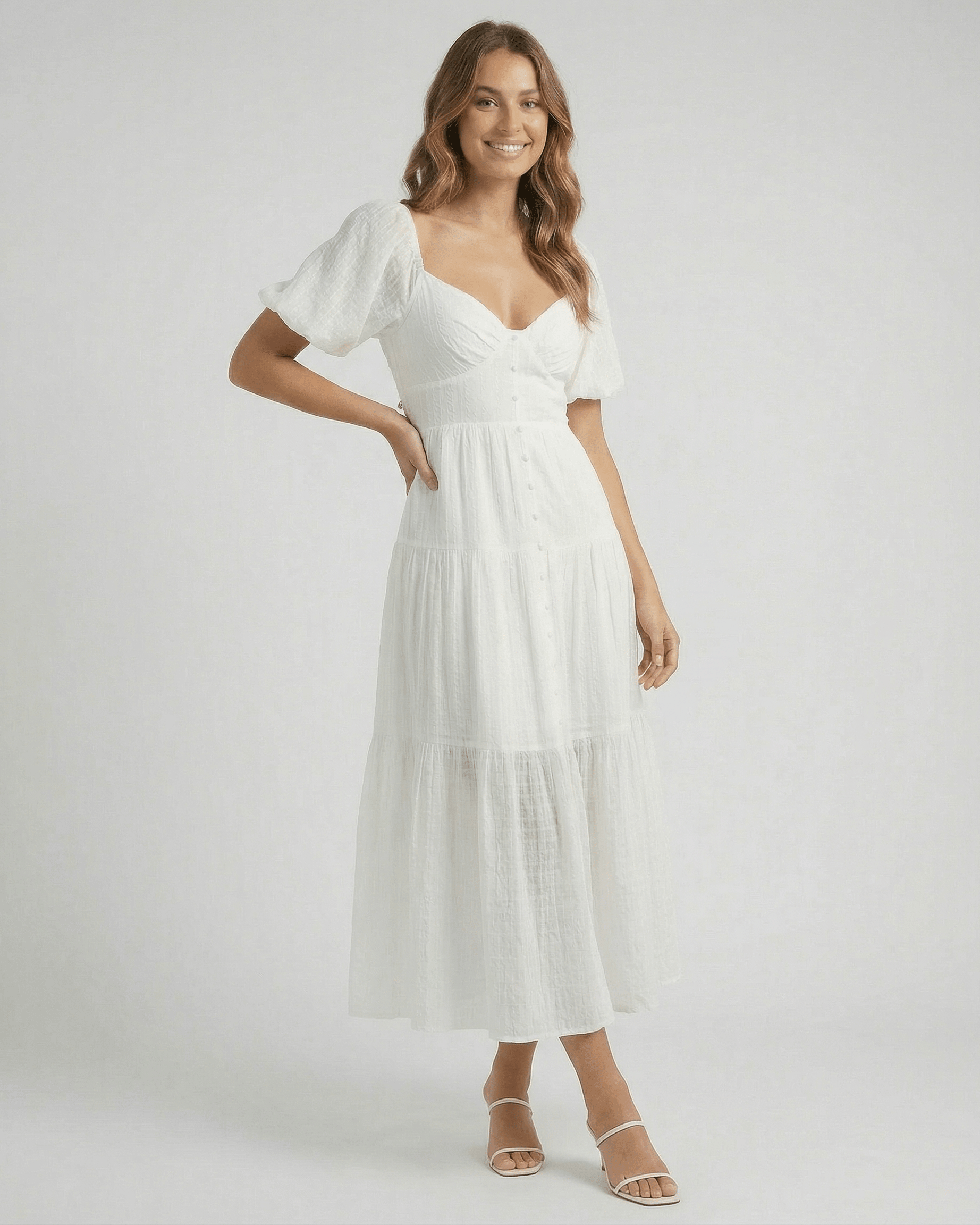 Elara Midi Dress by Lauven – Elegant white A-line silhouette with puff sleeves, offering modern femininity.
