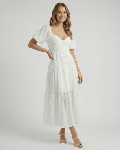 Elara Midi Dress by Lauven – Elegant white A-line silhouette with puff sleeves, offering modern femininity.