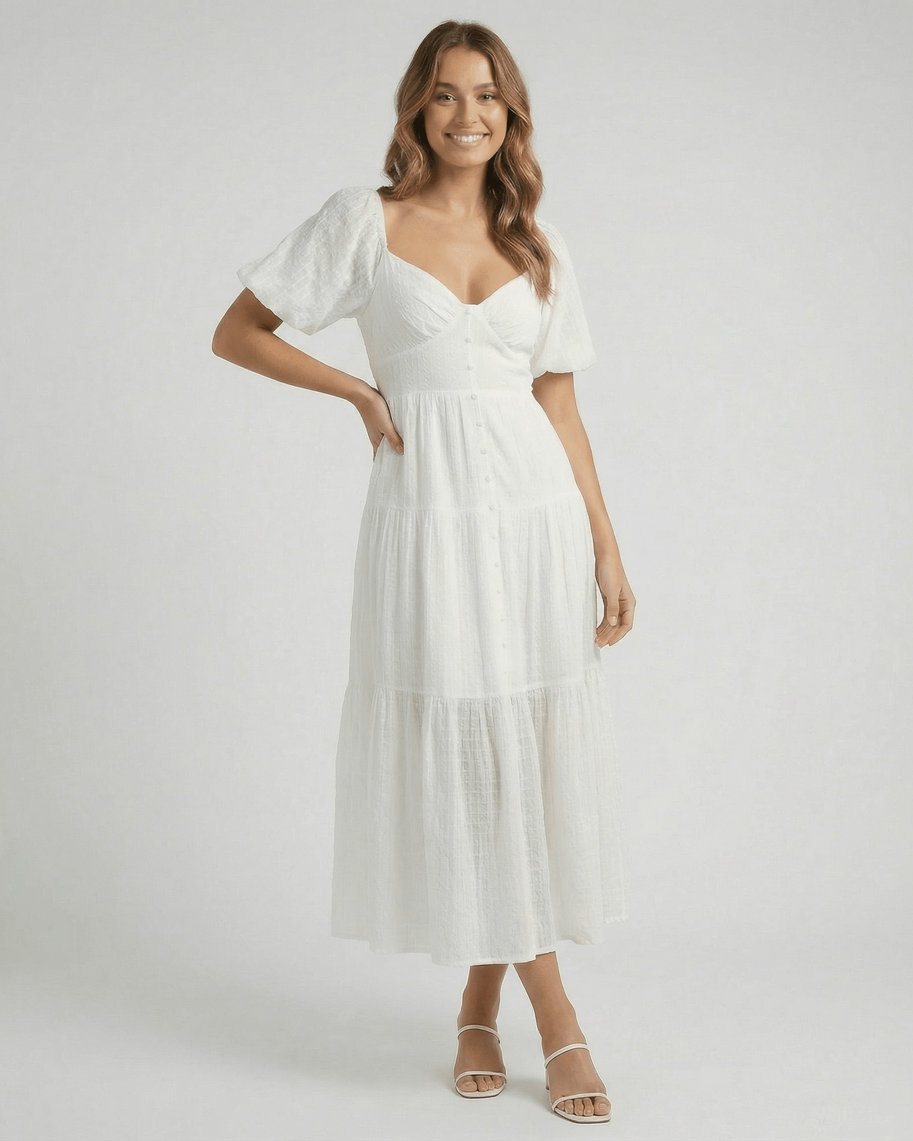 Elara Midi Dress by Lauven - Elegant white A-line silhouette with puff sleeves, showcasing contemporary femininity.