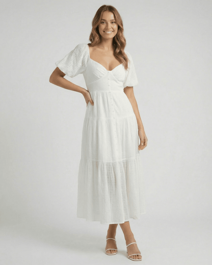 Elara Midi Dress by Lauven - Elegant white A-line silhouette with puff sleeves, showcasing contemporary femininity.