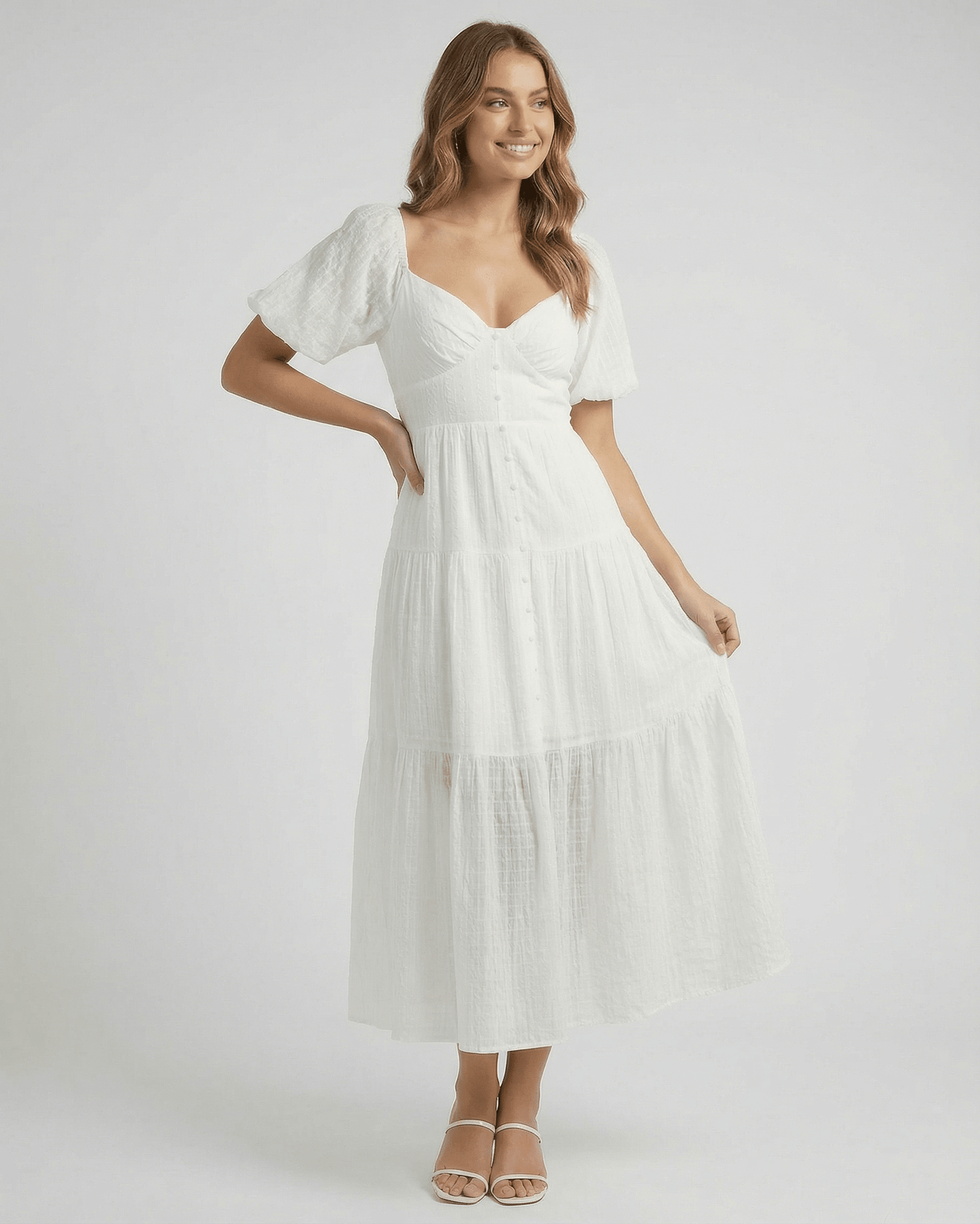 Elara Midi Dress by Lauven – Elegant white A-line silhouette with puff sleeves and flowing design.