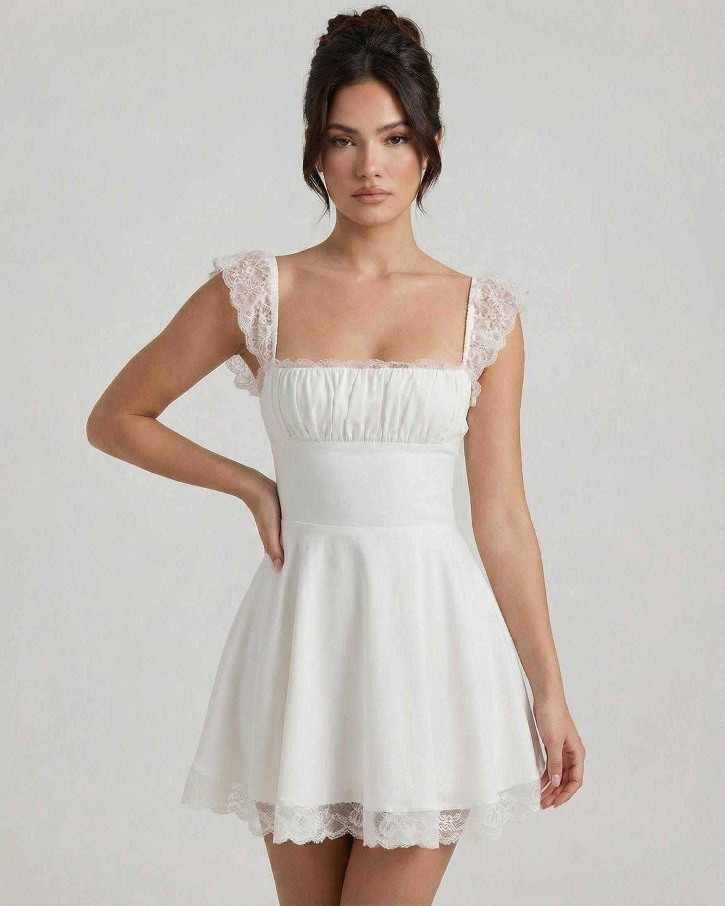 Elara Mini Dress by Lauven, featuring lace cap sleeves and a vintage A-line silhouette in soft white fabric.
