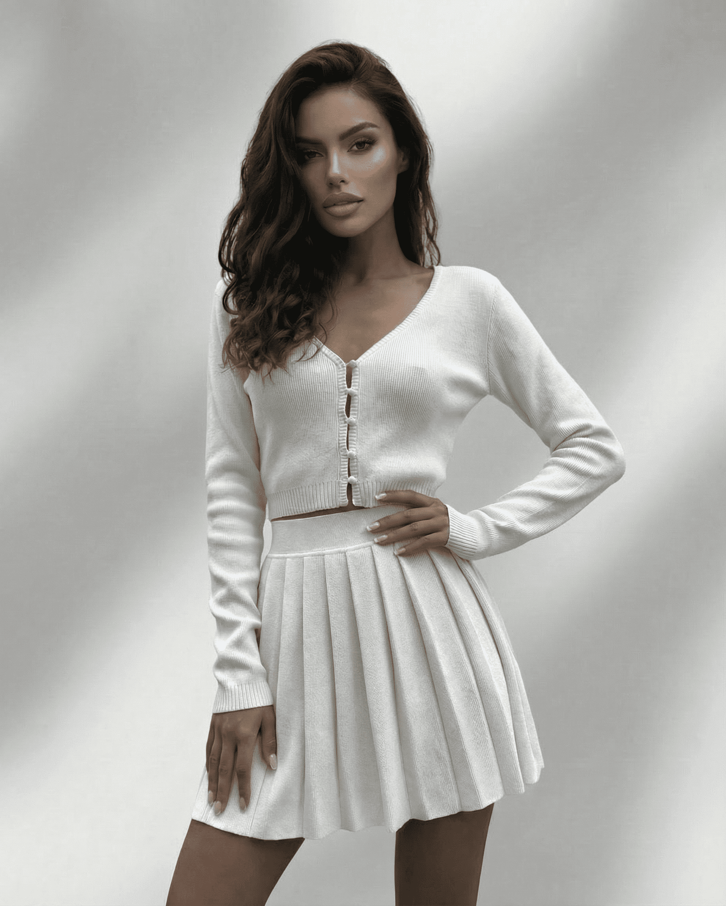 Elara Two-Piece Set featuring a knit cardigan and pleated mini skirt by SLIMONA for a modern elegant look.
