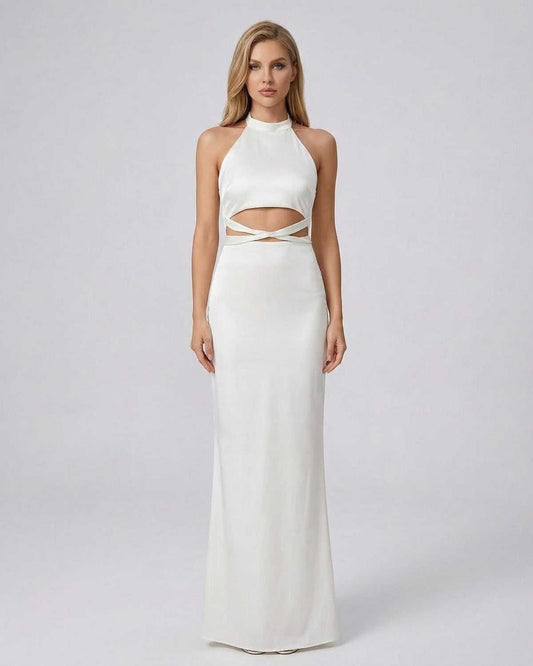 Elysia Maxi Dress by SLIMONA in solid white with a halter neck and modern cutout waist detail.