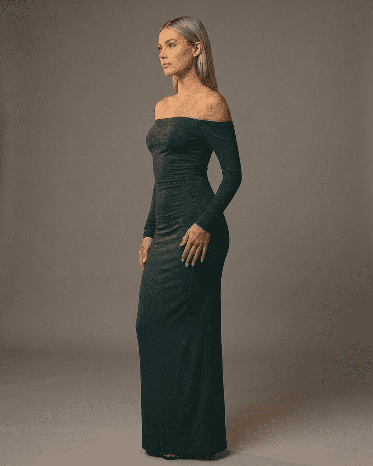Emerald Maxi Dress by SLIMONA – Off-shoulder long sleeve silhouette highlighting a sleek design.