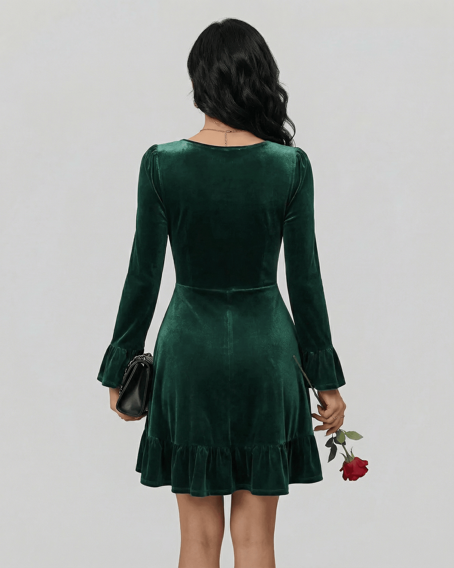 Emeraldia Mini Dress by Lauven, showcasing a back view with long sleeves and a flared hem in luxurious deep green.