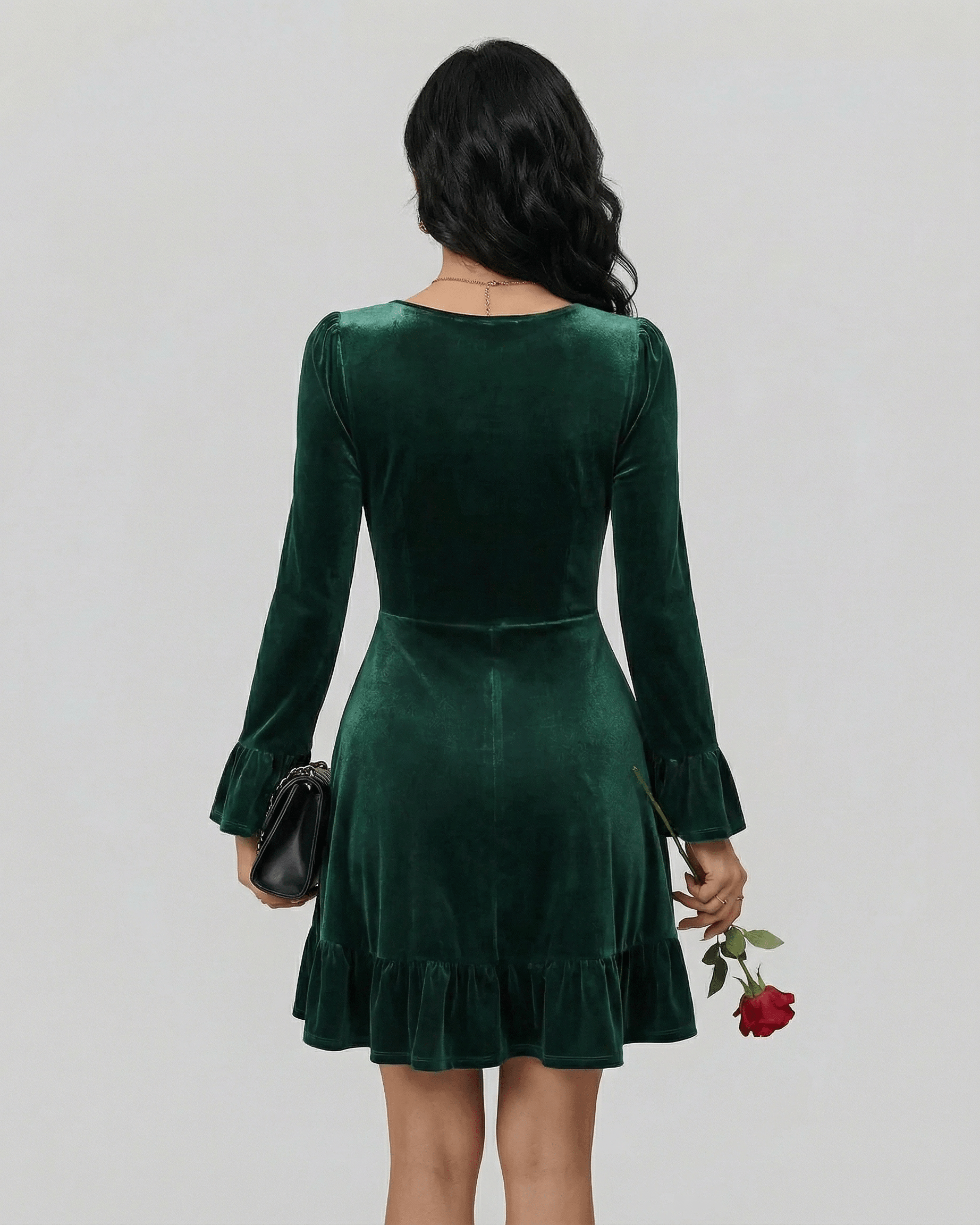 Emeraldia Mini Dress by Lauven, showcasing a back view with long sleeves and a flared hem in luxurious deep green.