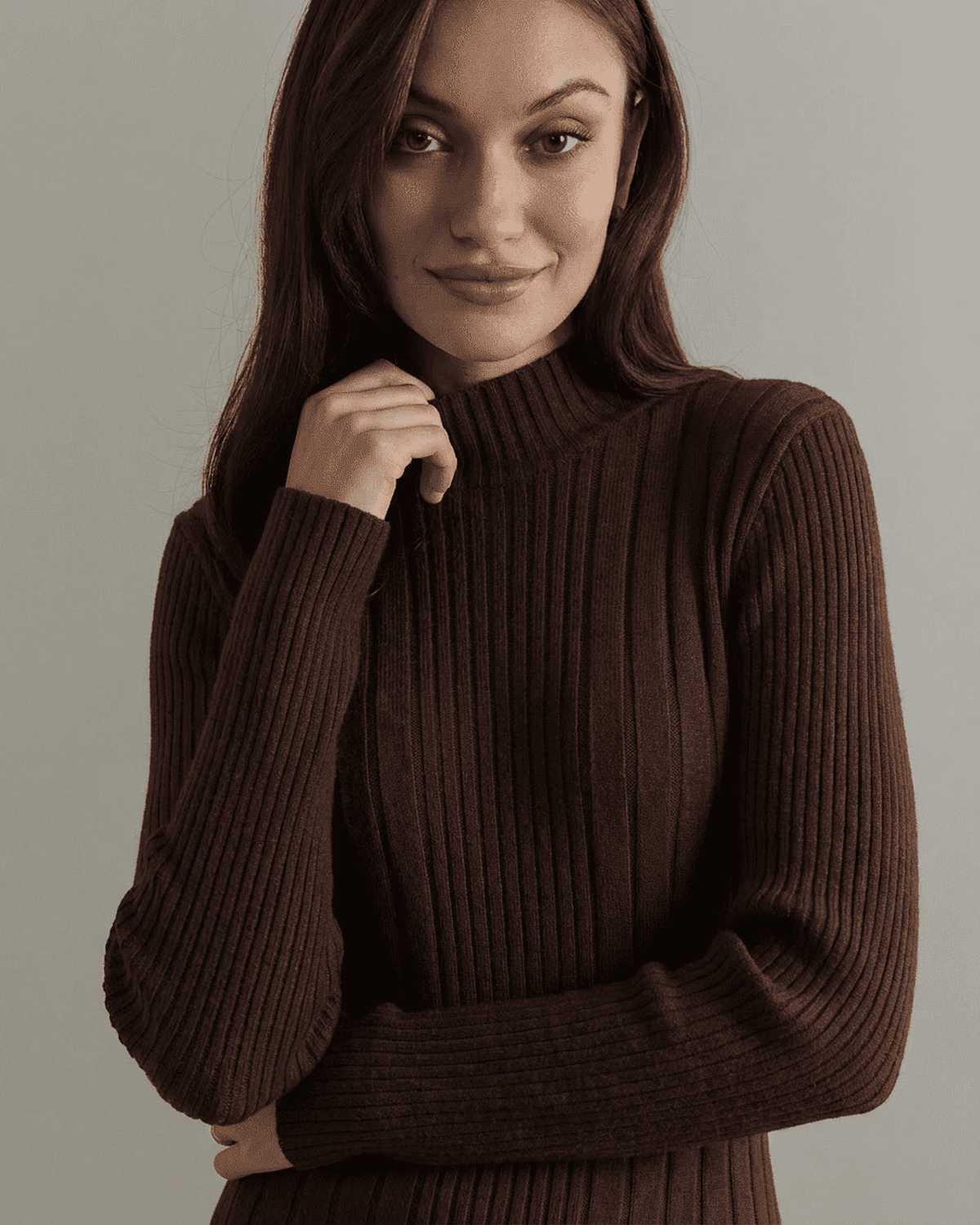 Florence Mini Dress by SLIMONA featuring a model in a ribbed knit, mock neck, long sleeve design.