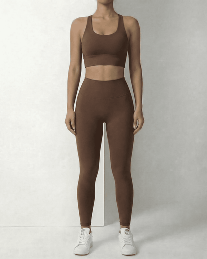 Model wearing SLIMONA Hazel Leggings and matching sports bra in sleek brown, showcasing comfort and style.