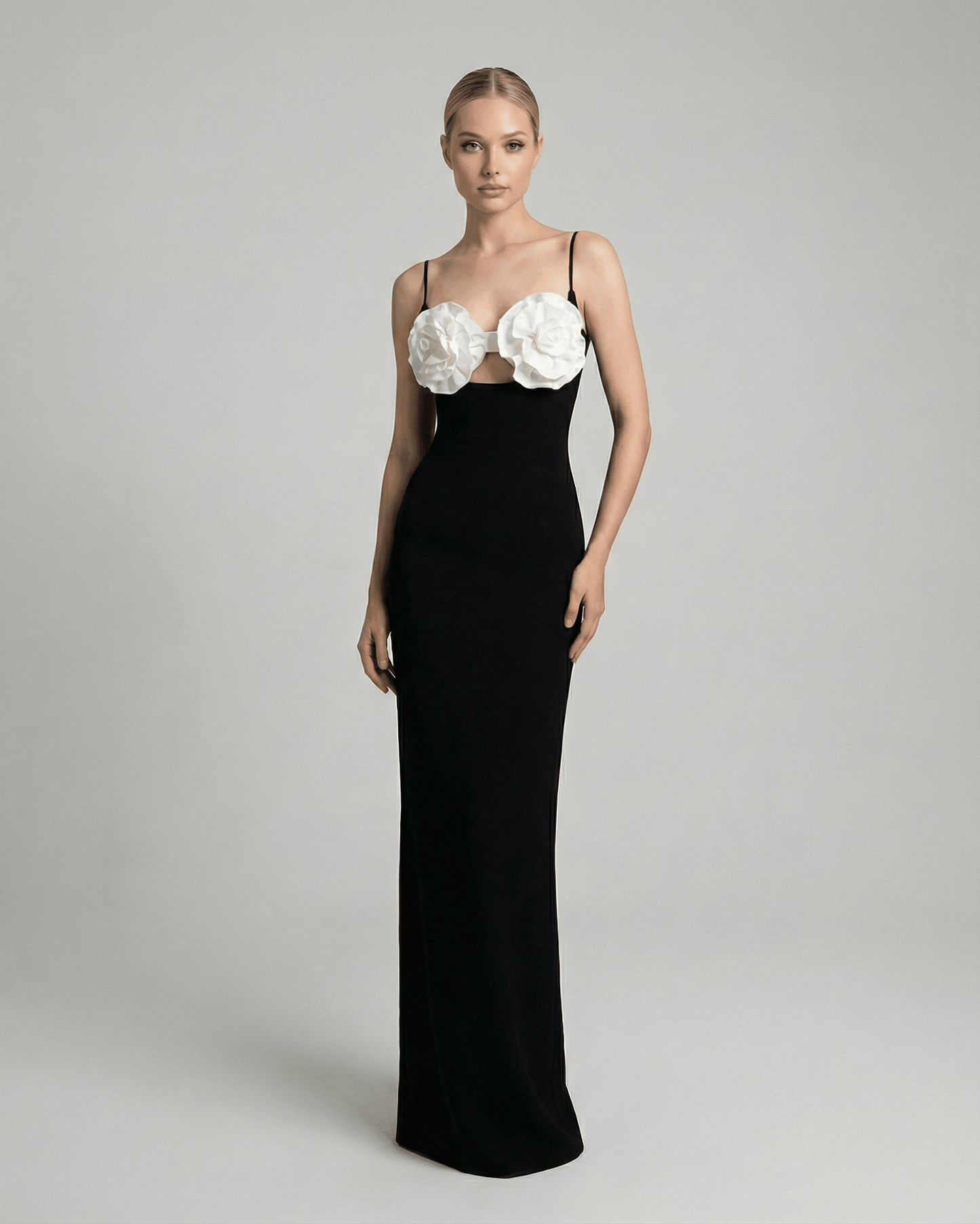 Celeste Maxi Dress by Lauven featuring floral embellished bust and sleek silhouette in black knit fabric.