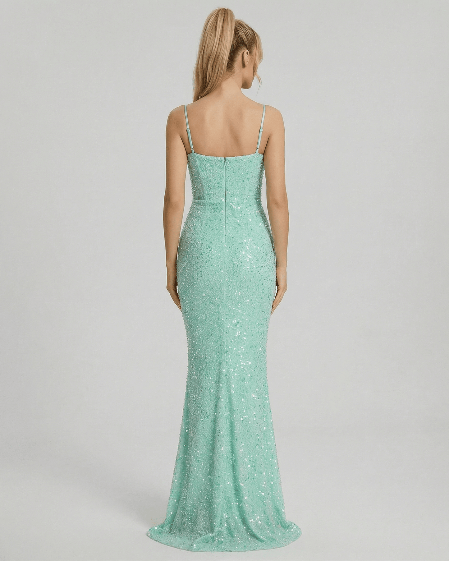 Celeste Maxi Dress by Lauven featuring a shimmering green mermaid silhouette and spaghetti straps from the back view.