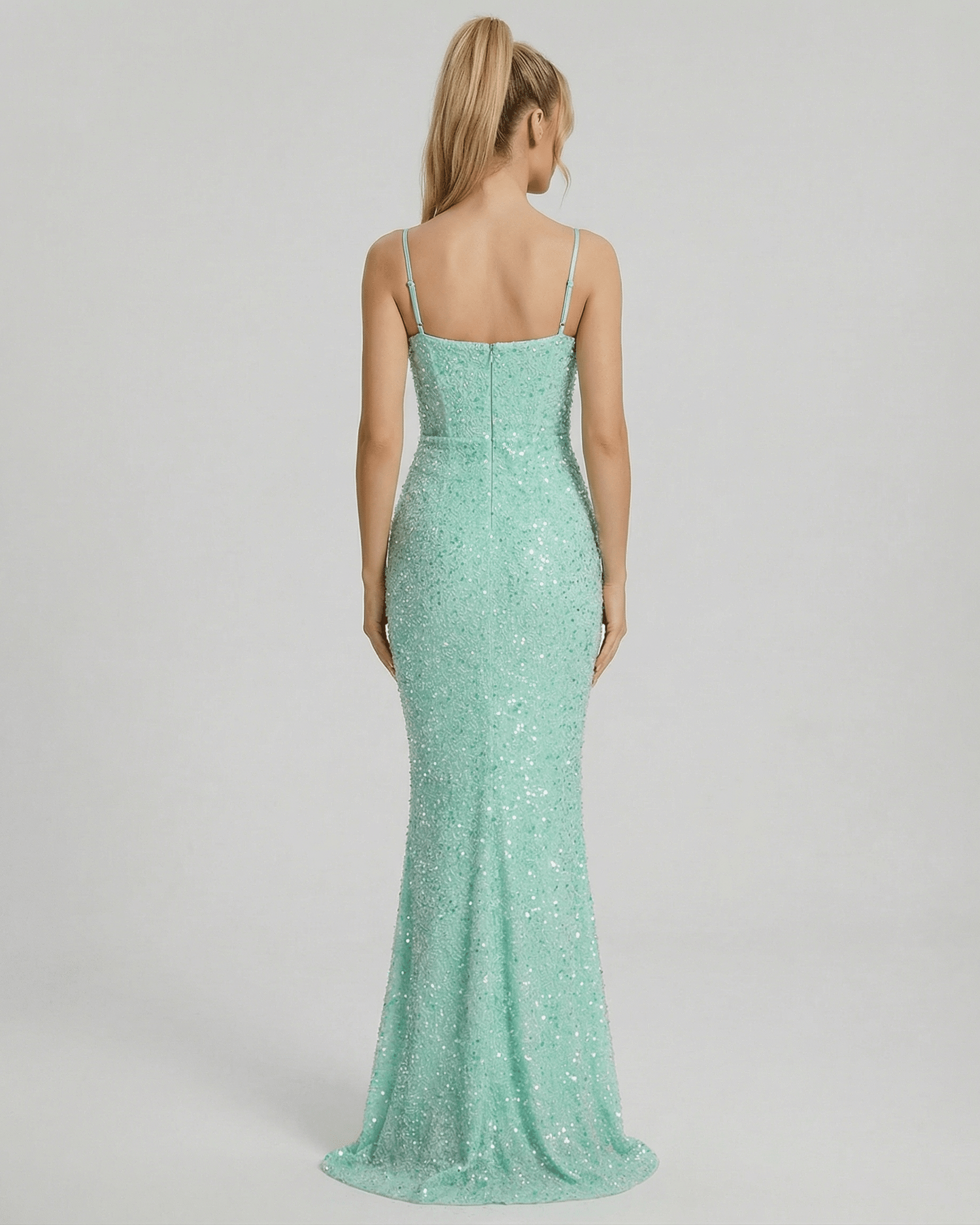 Celeste Maxi Dress by Lauven featuring a shimmering green mermaid silhouette and spaghetti straps from the back view.