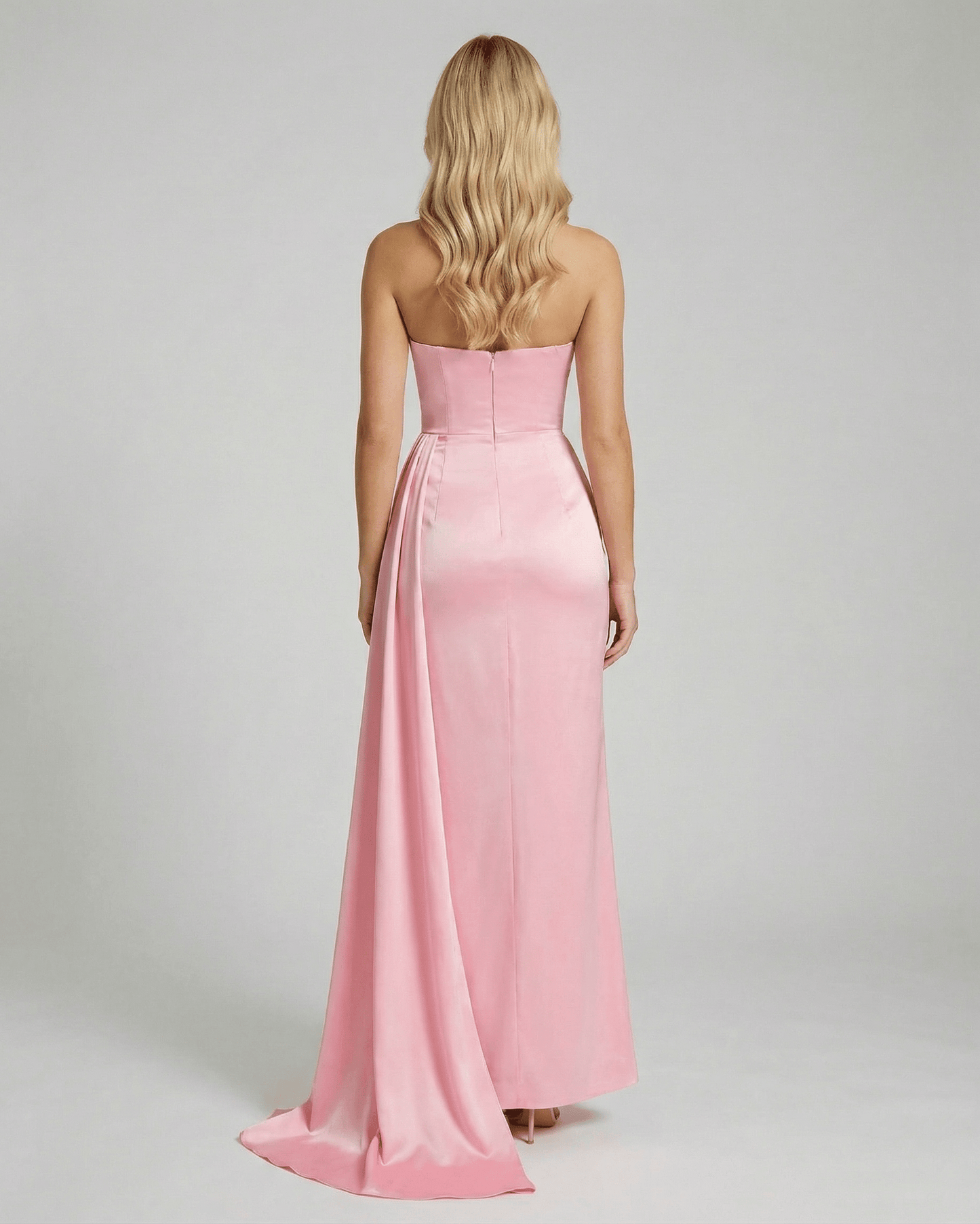 Back view of Celeste Maxi Dress by Lauven, showcasing elegant pink satin fabric and a sleek silhouette.