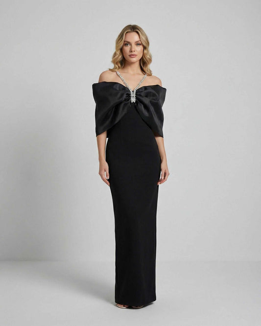 Celeste Maxi Dress by Lauven featuring an oversized bow and elegant off-shoulder design in luxurious black fabric.