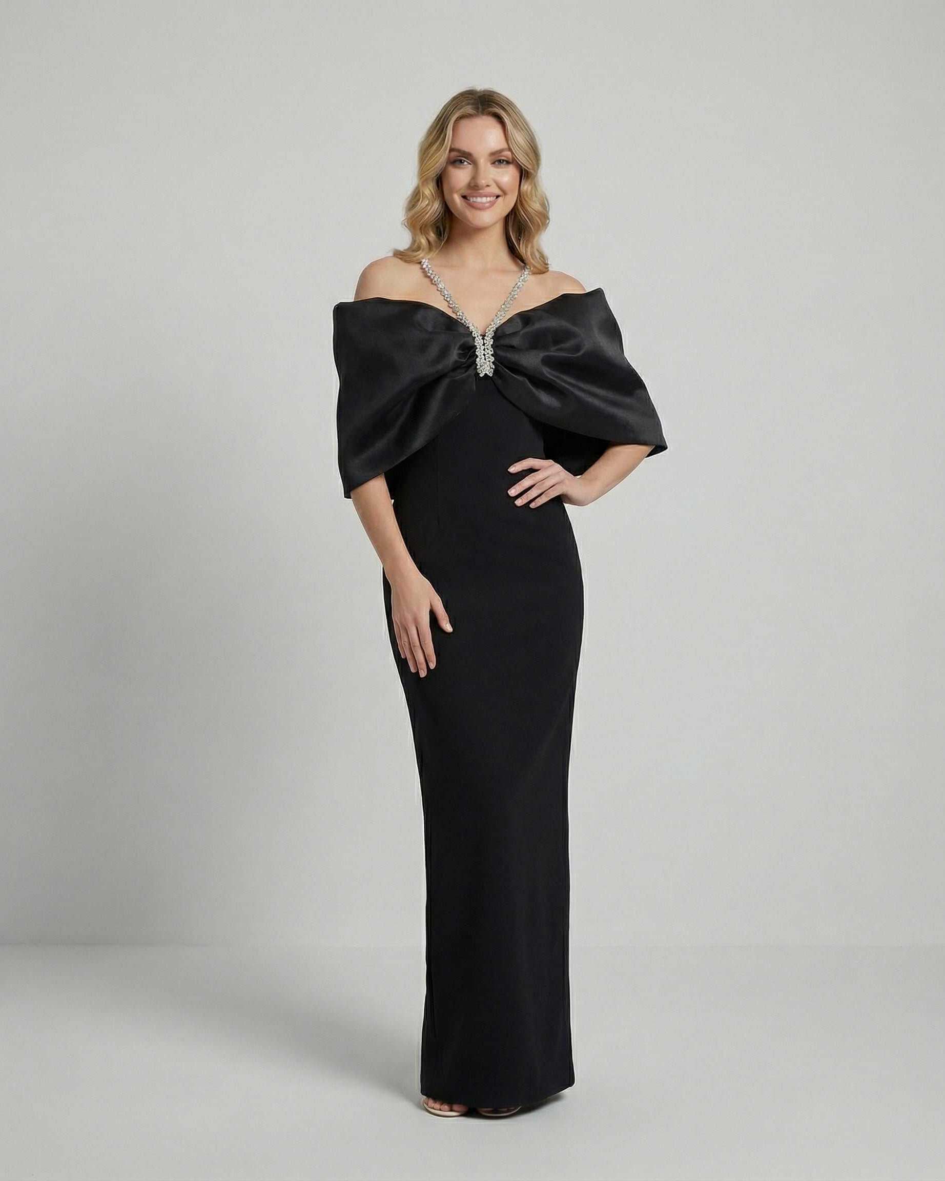 Lauven Celeste Maxi Dress featuring dramatic bow and elegant silhouette in black fabric.