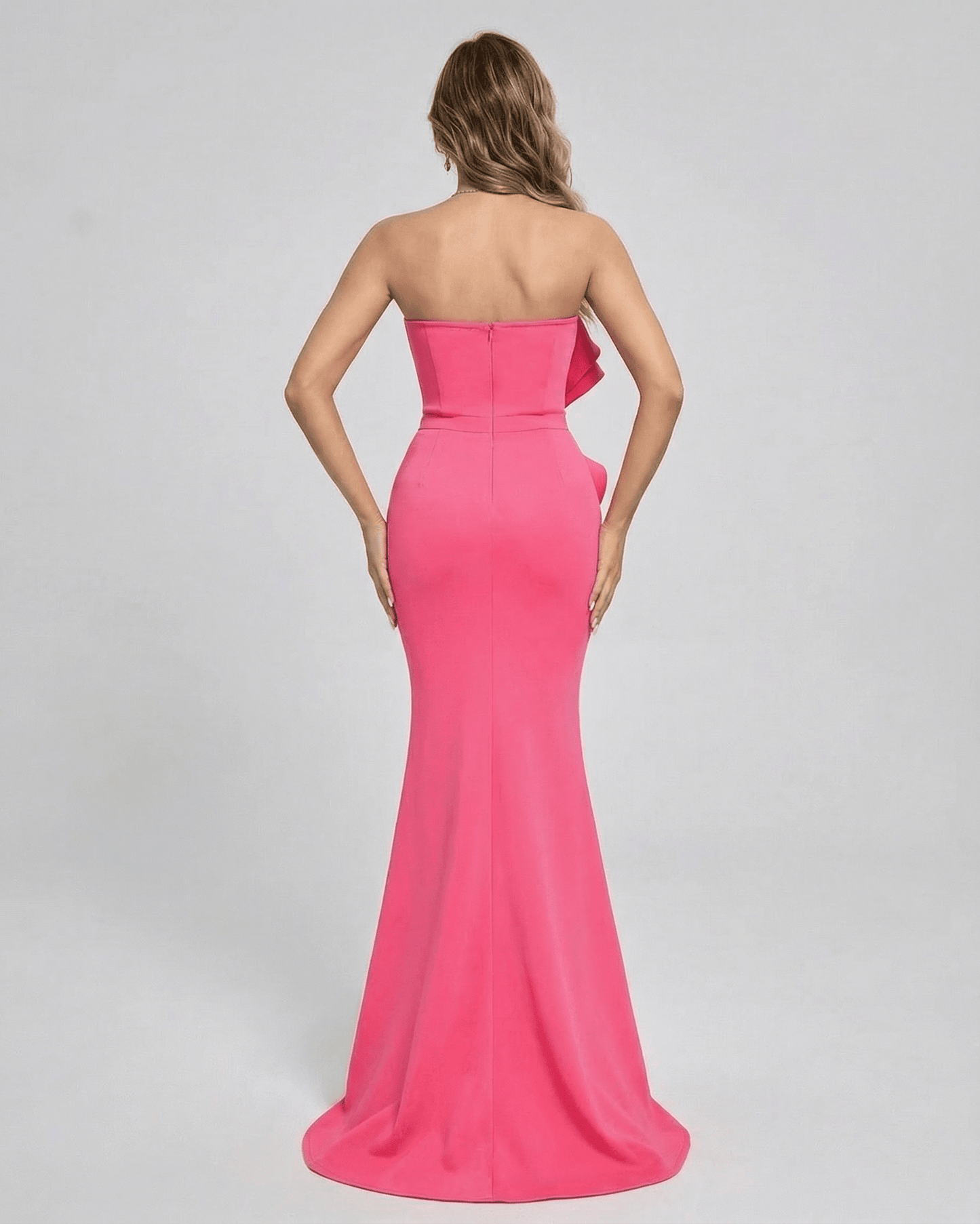 Back view of Celeste Maxi Dress by Lauven in vibrant pink with elegant ruffle detail.