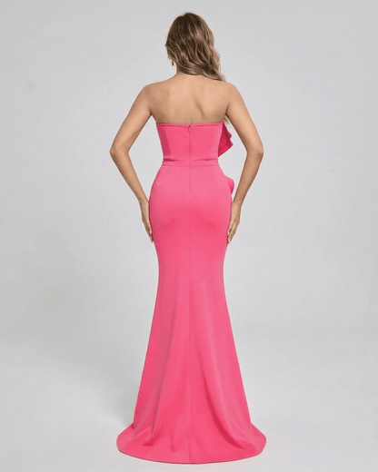 Back view of Celeste Maxi Dress by Lauven in vibrant pink with elegant ruffle detail.