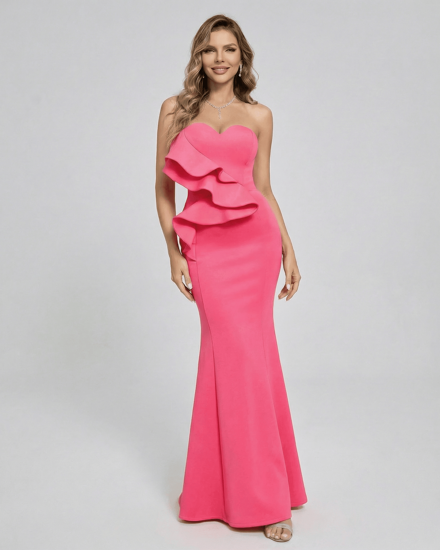 Celeste Maxi Dress by Lauven, vibrant pink strapless dress with elegant ruffle detail and sleek trumpet silhouette.
