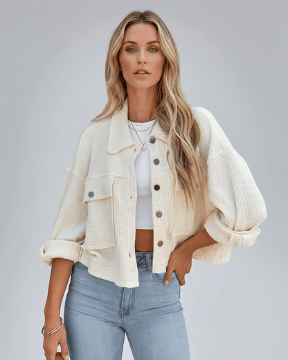 Sahara Jacket from Lauven – Women’s oversized cream cropped jacket styled casually with jeans.