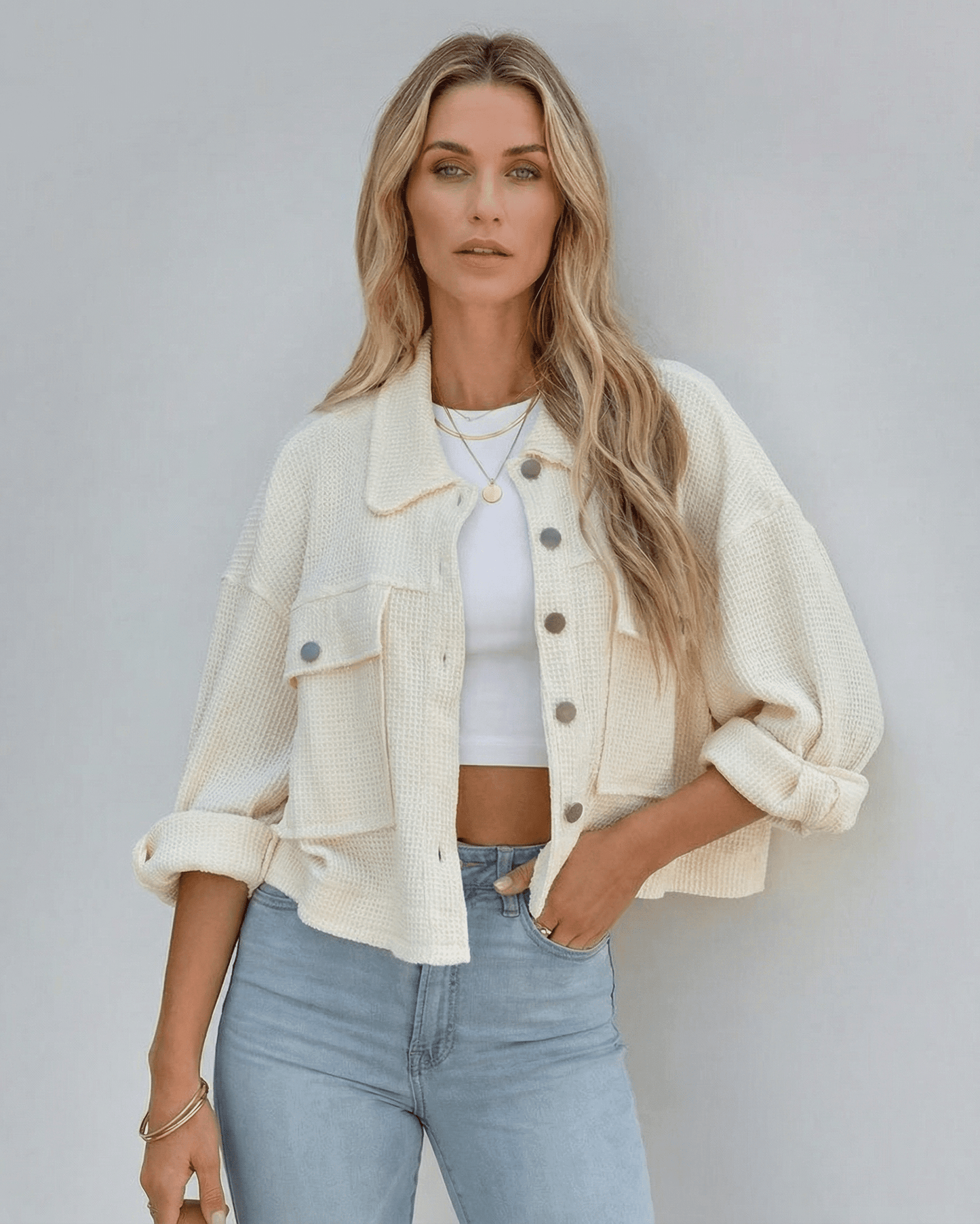 Sahara Jacket by Lauven - Women’s cropped cream jacket with oversized silhouette, styled with a white top and blue jeans.
