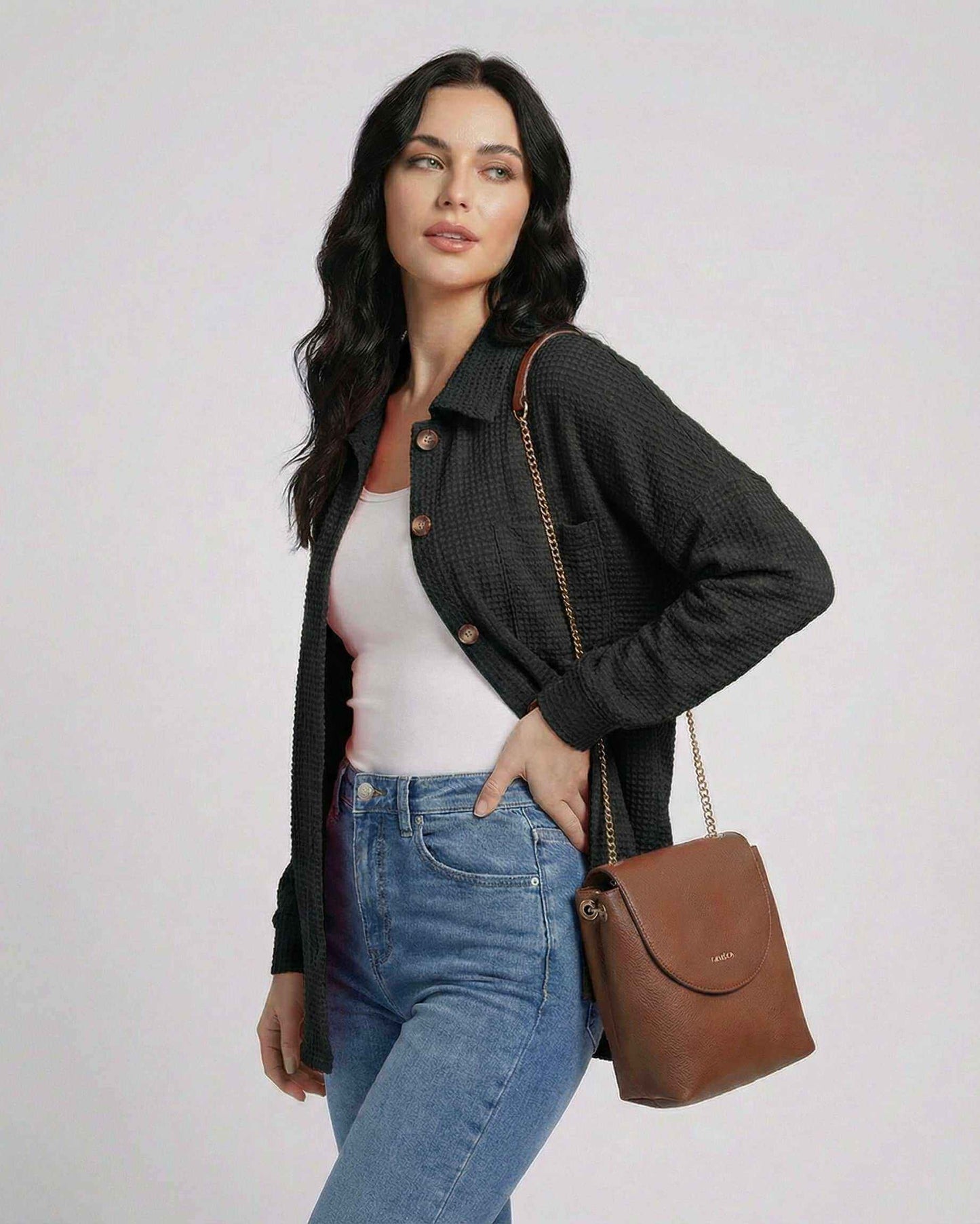 Milano Jacket by Lauven - Women’s black waffle knit jacket with longline fit, paired with a stylish handbag.
