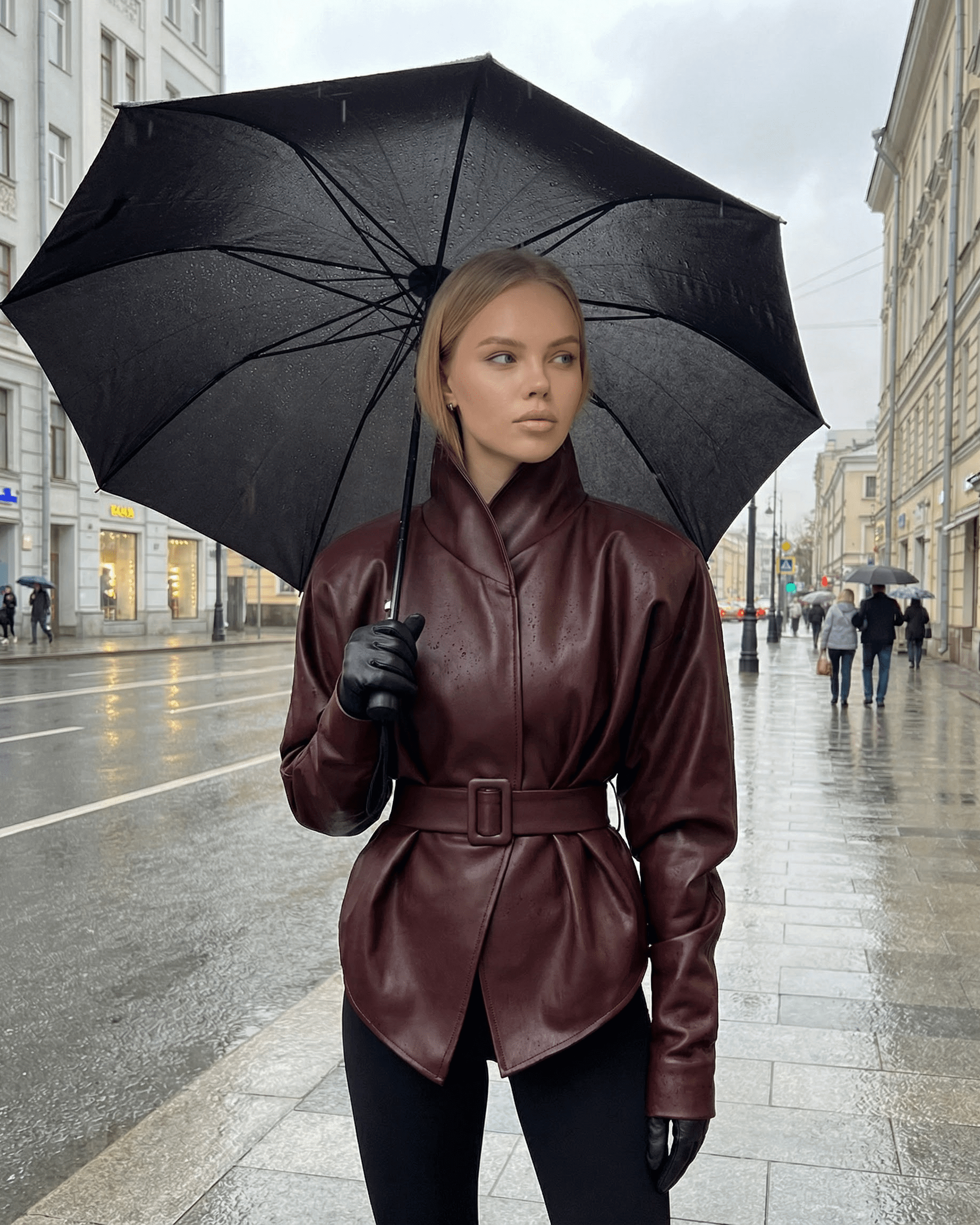 Verona Jacket - Women’s Burgundy Leather Jacket by Lauven, styled with umbrella, embodying modern streetwear.