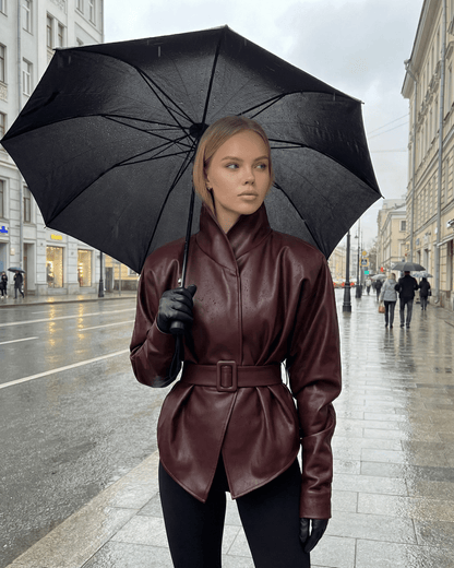Verona Jacket - Women’s Burgundy Leather Jacket by Lauven, styled with umbrella, embodying modern streetwear.