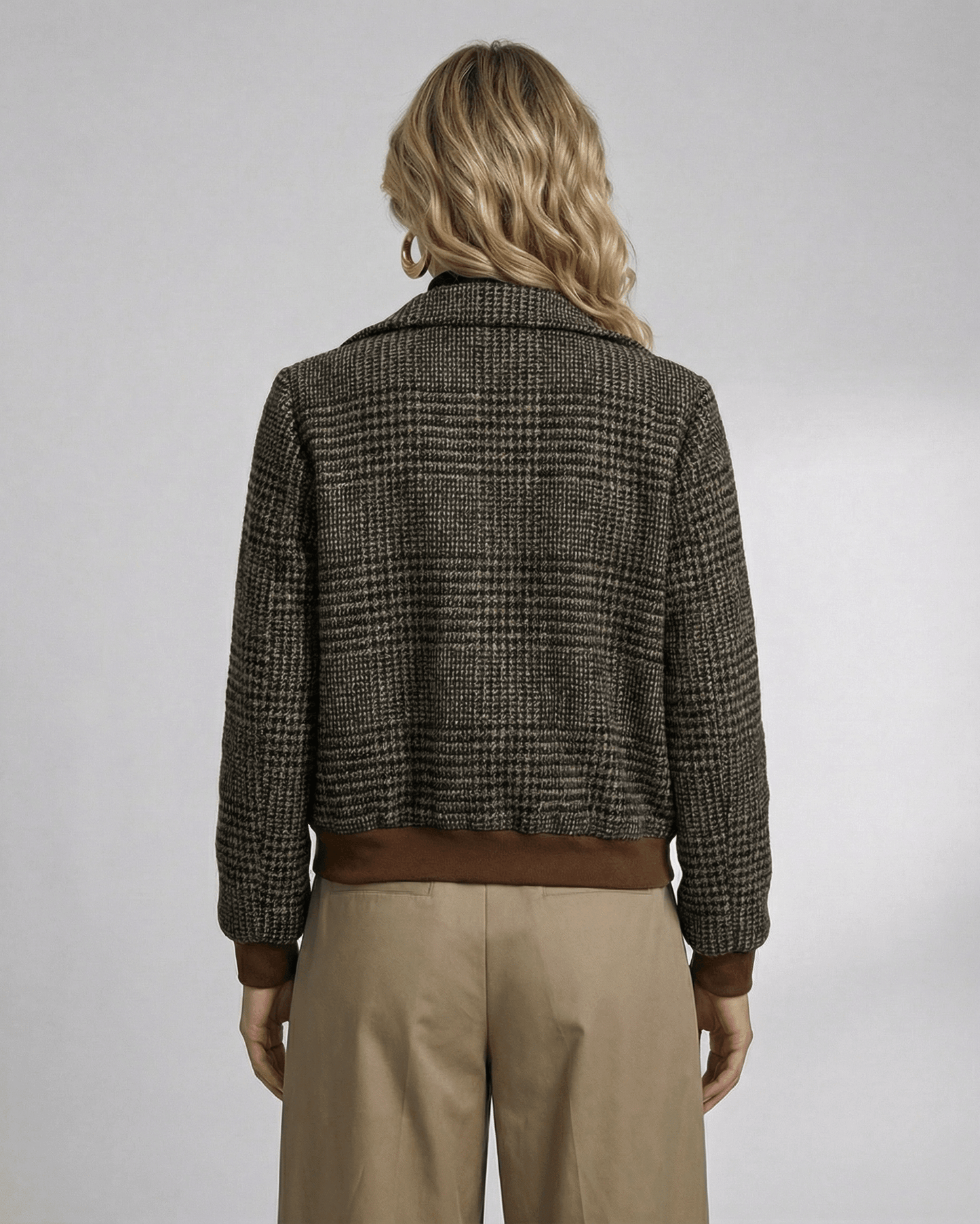 Back view of a woman in a Lauven Cambridge Jacket featuring a plaid design and stylish lapel collar.