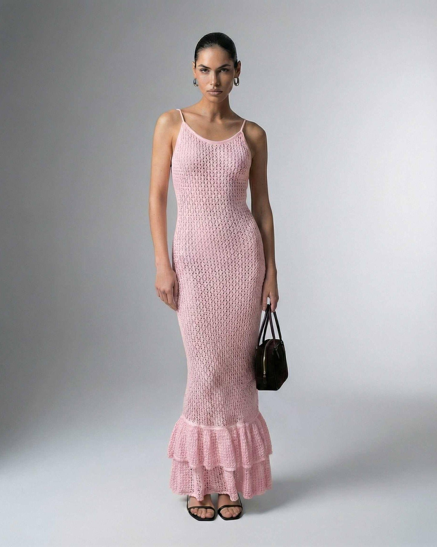 Rosaline Maxi Dress by Lauven – Pink bodycon dress with hollow out knit texture and ruffled hem.