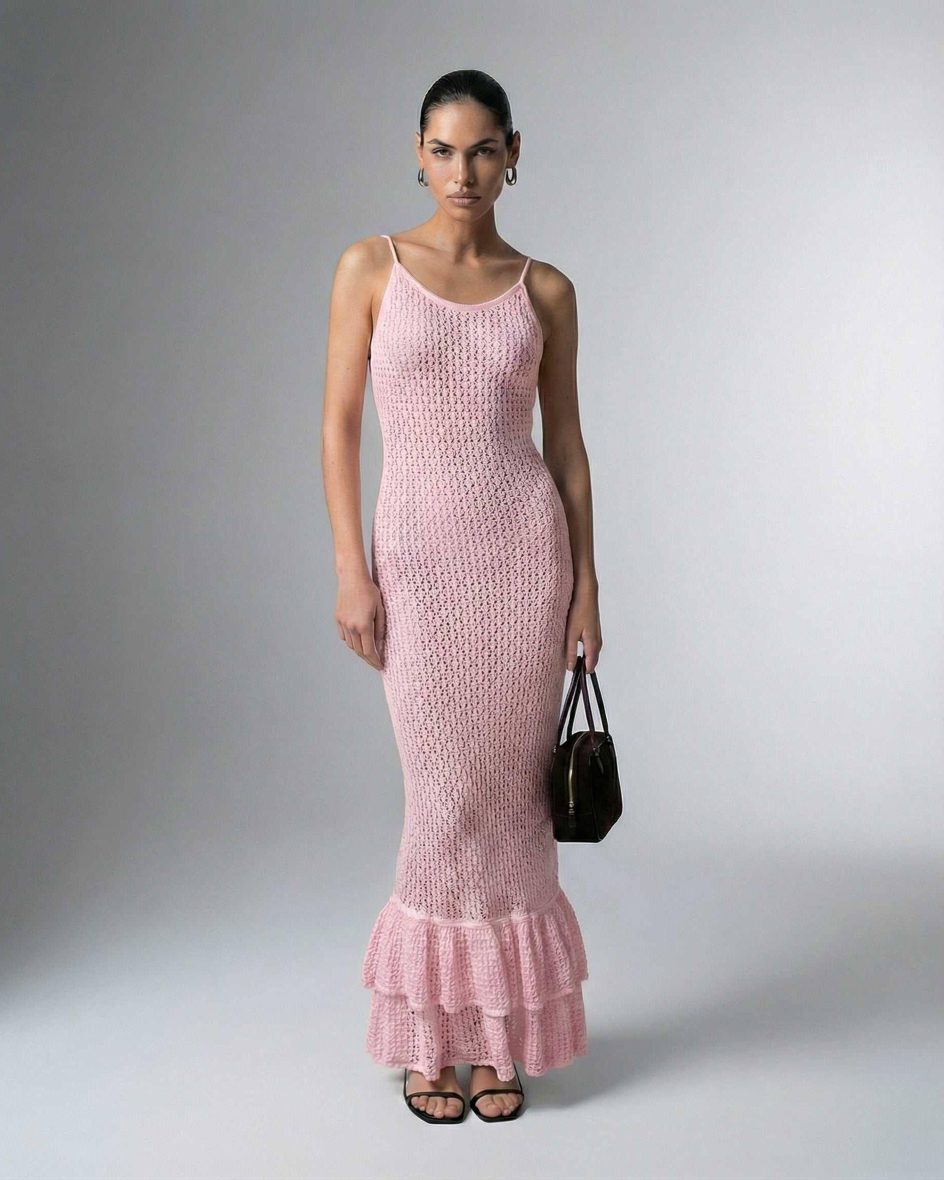 Rosaline Maxi Dress by Lauven – Pink bodycon dress with hollow out knit texture and ruffled hem.