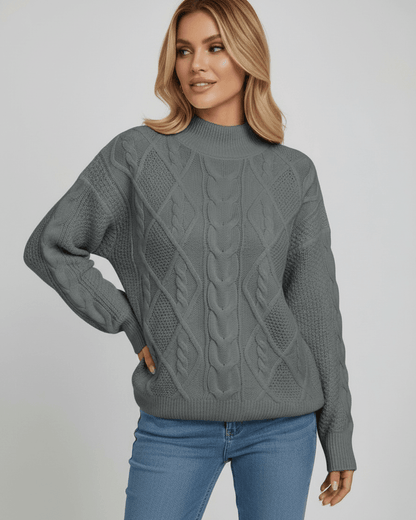 Monaco Sweater by Lauven in gray, featuring oversized cable knit design and structured crew neck for chic fall style.