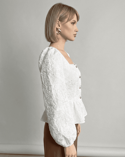 Ivory Corset Top by SLIMONA featuring a jacquard texture and puff sleeves for a refined look.