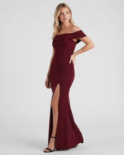 Kate Maxi Dress by SLIMONA in burgundy, featuring elegant off-the-shoulder design and thigh-high slit for a sophisticated look.