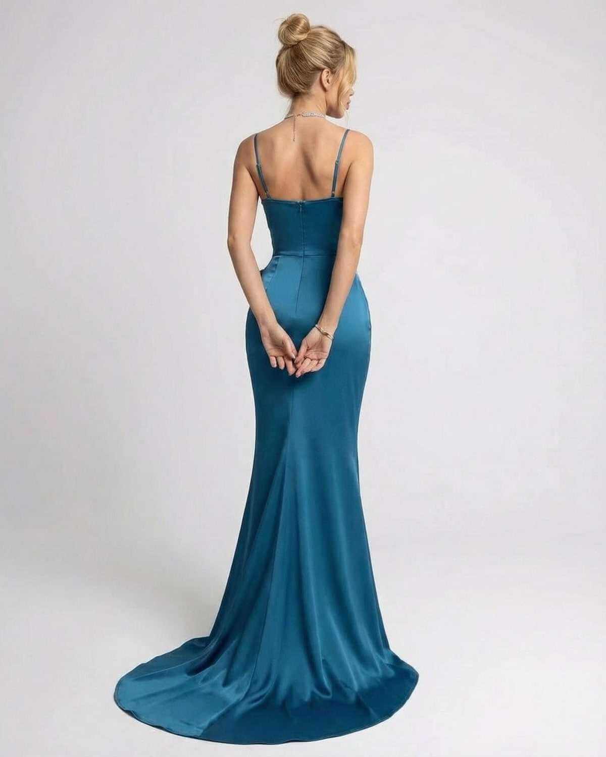 Laguna Maxi Dress by SLIMONA - Elegant asymmetrical sleeveless dress in solid teal with dramatic side bow detail.