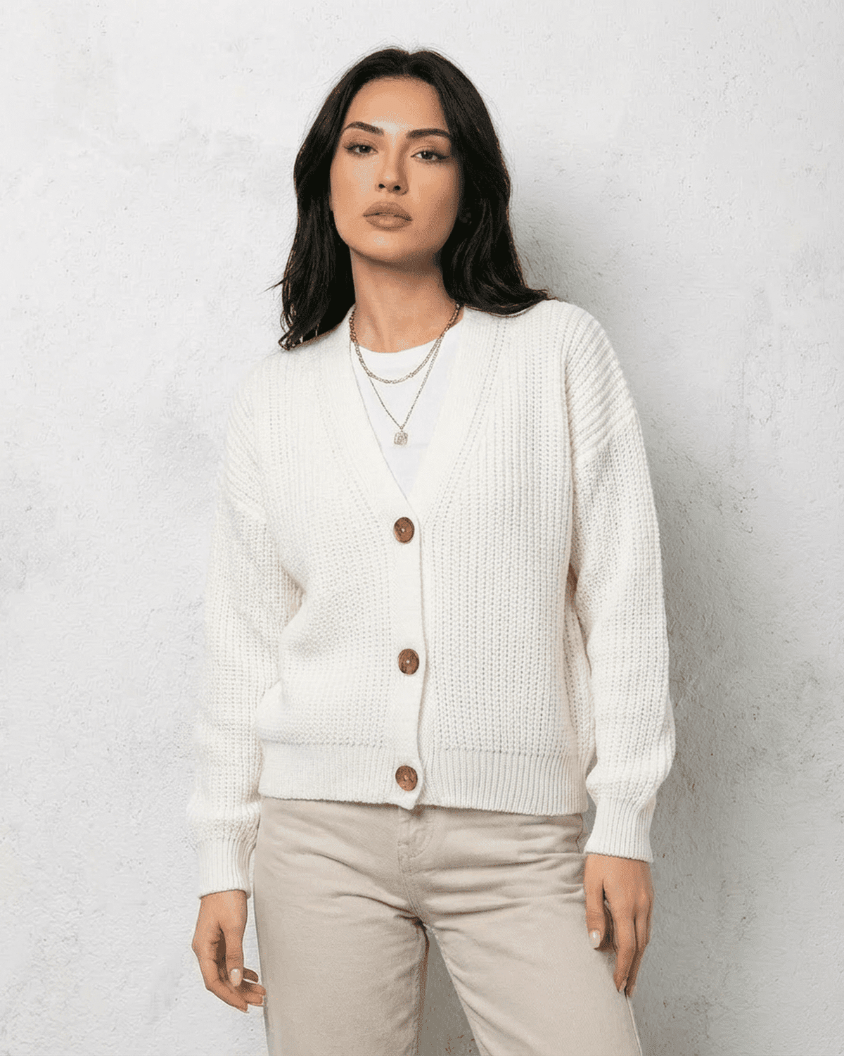 Alba Cardigan by SLIMONA - Classic white knitwear with a soft V-neck and button detail for effortless layering.