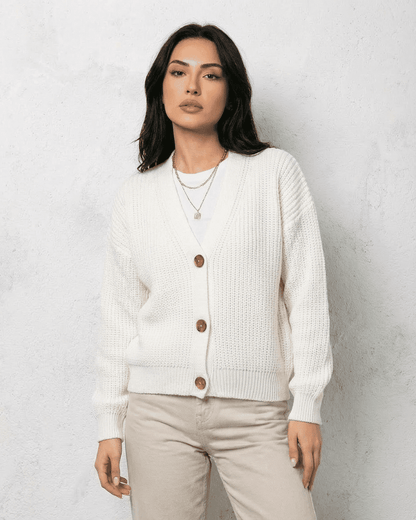 Alba Cardigan by SLIMONA - Classic white knitwear with a soft V-neck and button detail for effortless layering.