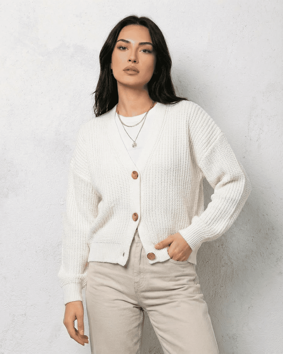 Alba Cardigan by SLIMONA, classic white knitwear with soft V-neck design and button details, perfect for layering.