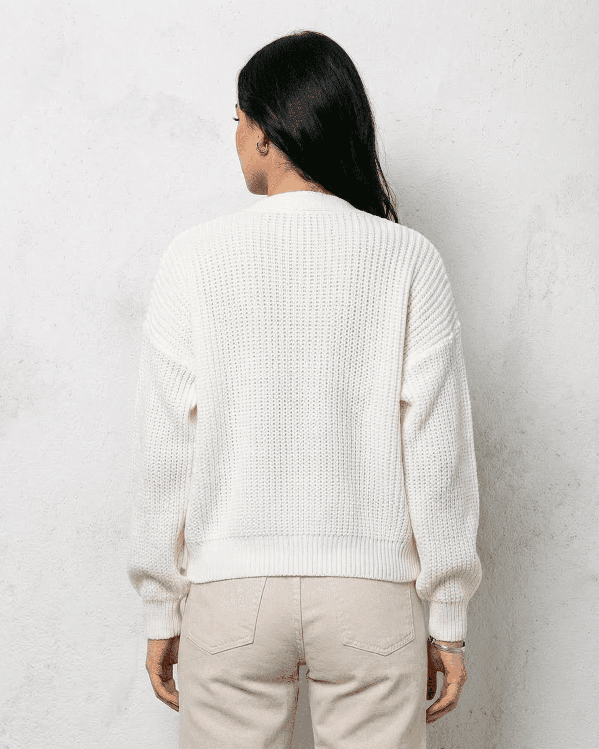 Back view of Alba Cardigan by SLIMONA, showcasing its classic white knit design and soft fit.