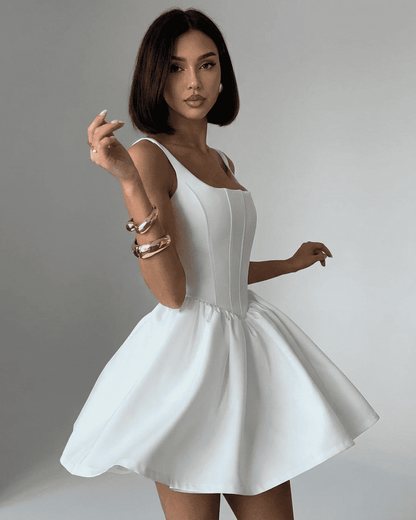 Alba Mini Dress by SLIMONA, a pure white structured corset mini dress with a square neckline and flared skirt.