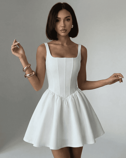 Alba Mini Dress by SLIMONA, a pure white structured corset mini with square neckline and flared skirt.