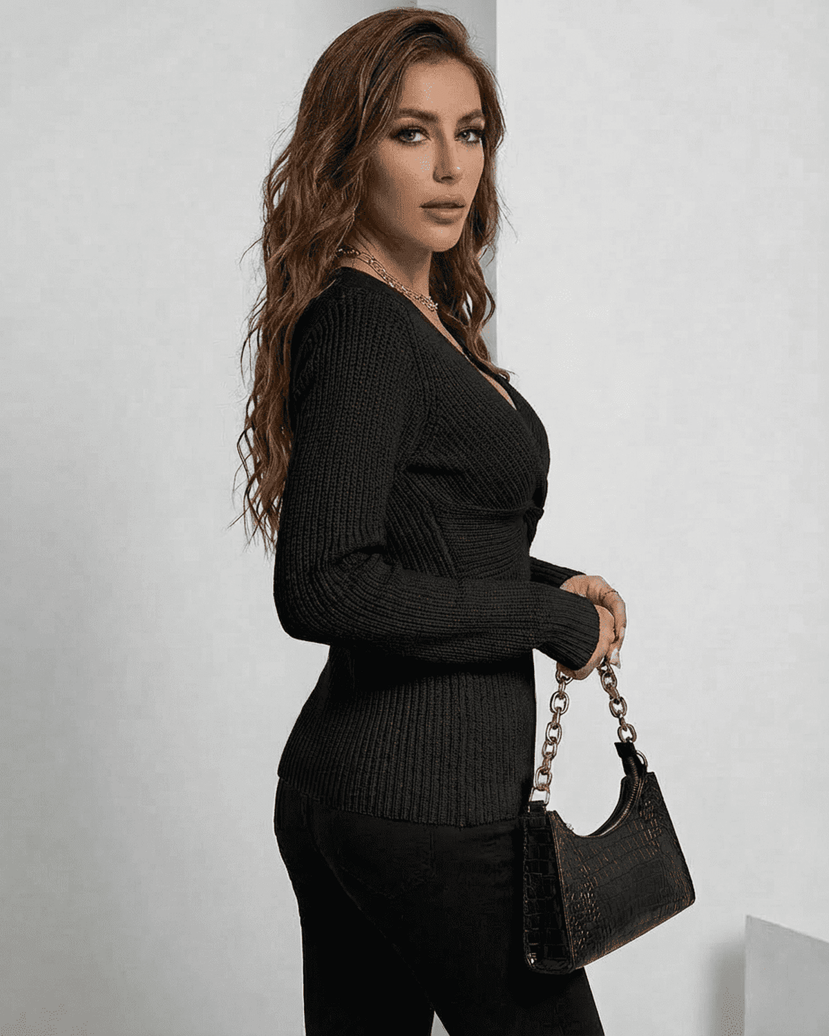 Alina Pullover: Sleek ribbed slim fit V-neck sweater in elegant black by SLIMONA, enhancing your silhouette with style.